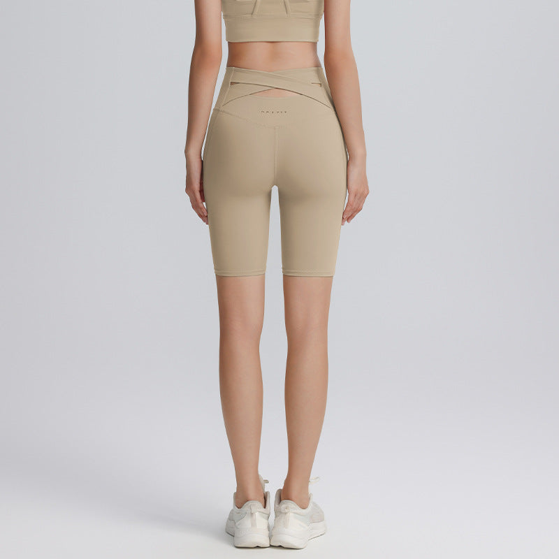 Cross hollow yoga pants stretch tight fitness pants nude breathable quick-drying high waist tummy five-point cycling pants