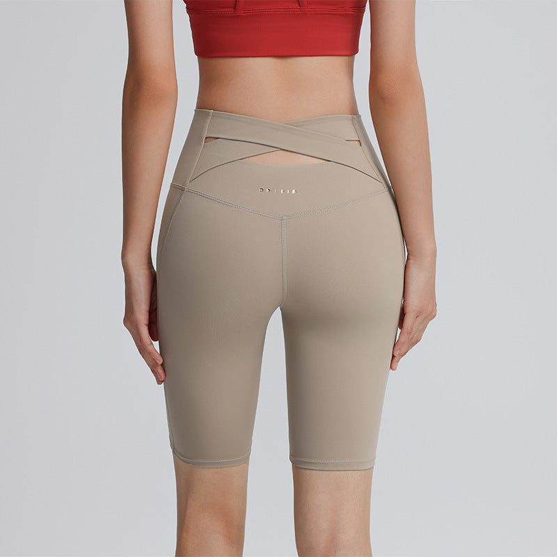 Cross hollow yoga pants stretch tight fitness pants nude breathable quick-drying high waist tummy five-point cycling pants